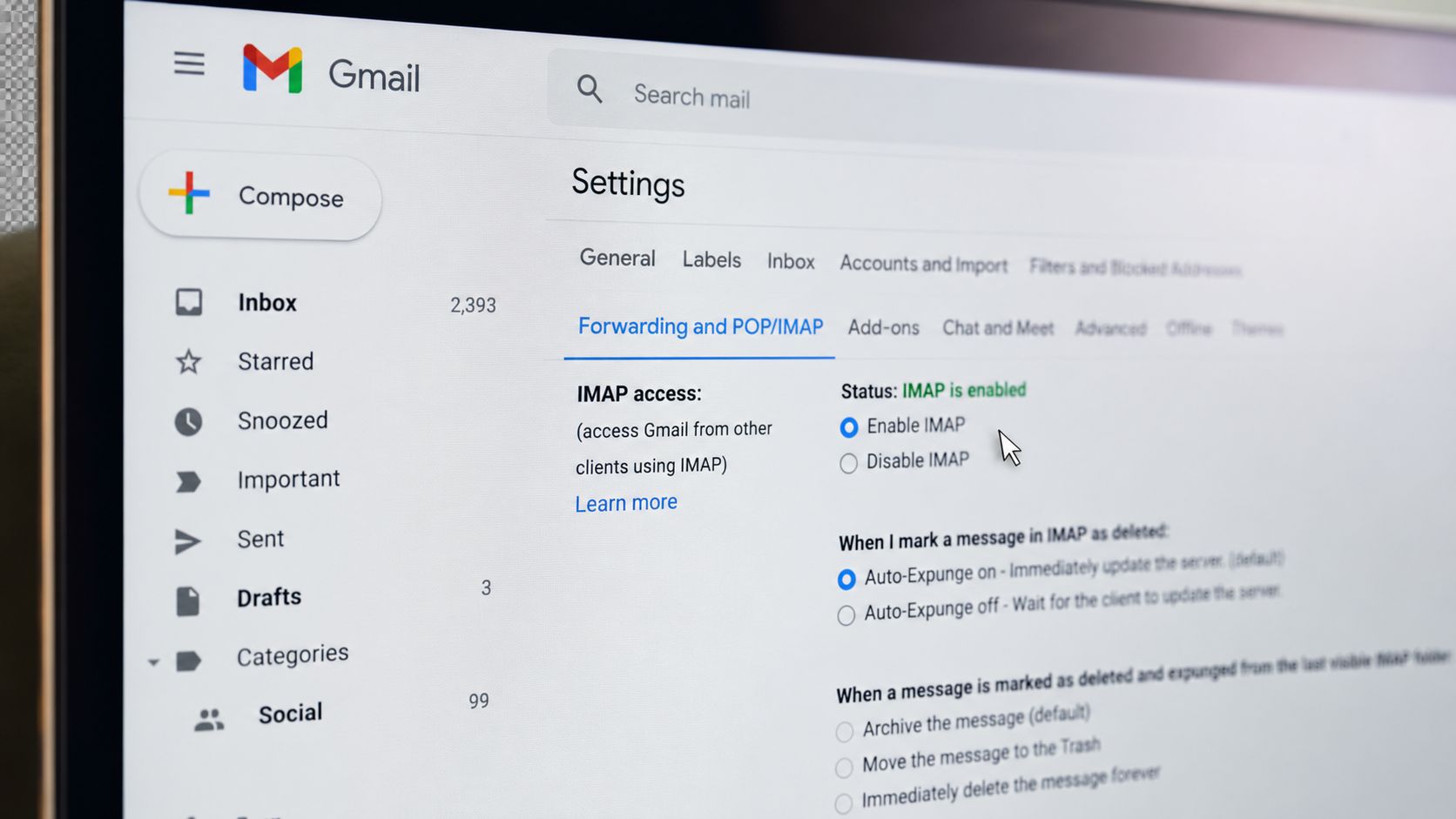 A close-up view of the Gmail settings menu showing the Forwarding and POP/IMAP configuration options.